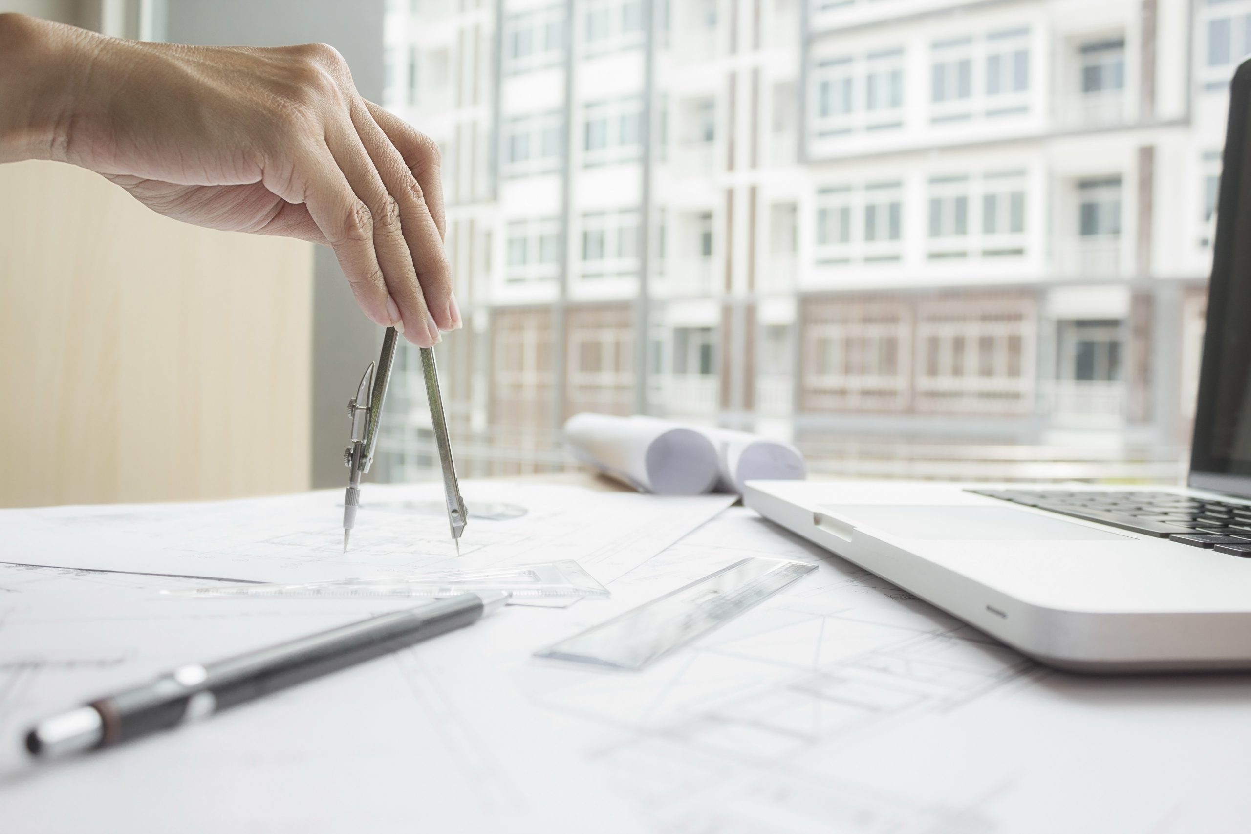 Hands of Engineer working on blueprint,Construction concept. Engineering tools.Vintage tone retro filter effect,soft focus(selective focus)